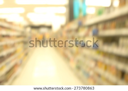 Abstract blurry warm ambient shelves in supermarket background