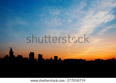 Bangkok city silhouette in early morning orange light background