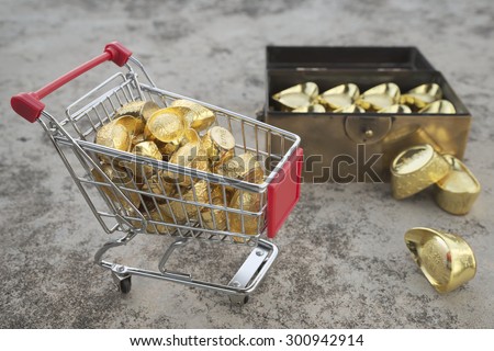 Abstract shallow DOF of gold transfering from treasure chest by pushcart with chineses word crafted on gold with meaning of good fortune, best of luck, and good health