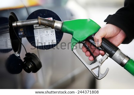 A man filling a car with petrol