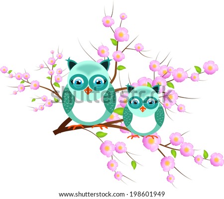 Two cute blue owls sitting on twig of tree