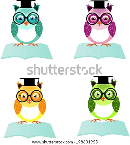 Set of four different colored owls sitting on open book