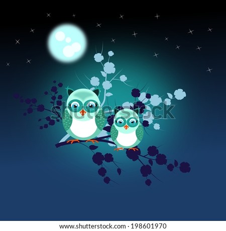 Two blue owls sitting on twig of tree in the night