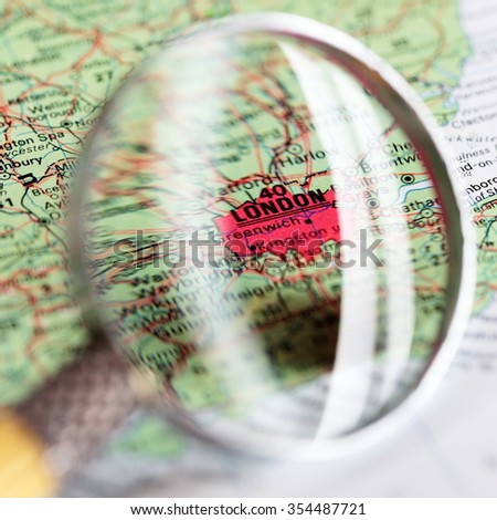 Map of London and magnifier glass.