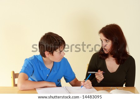 Teacher and student in a classroom at school