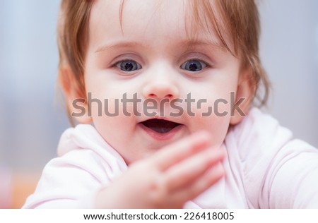 little baby on a blue background. positive emotions