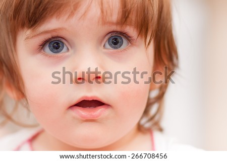 little baby on a blue background. positive emotions
