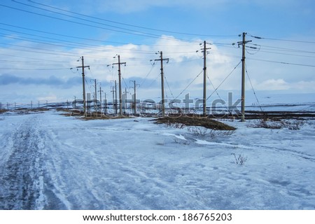 Electric Posts in snowy landscape in Russia