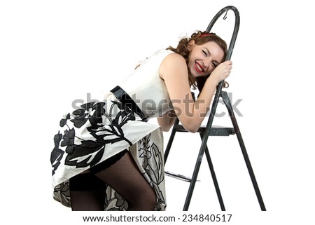 Photo smiling pin up woman down the stairs on white background