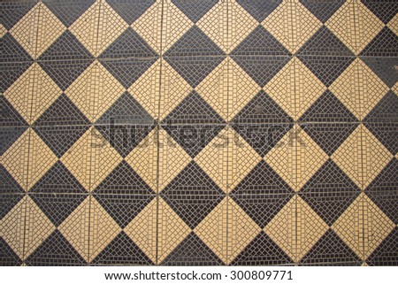 Photo of the old wall mosaic - chess pattern