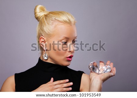 Image of woman with big diamond posing in studio