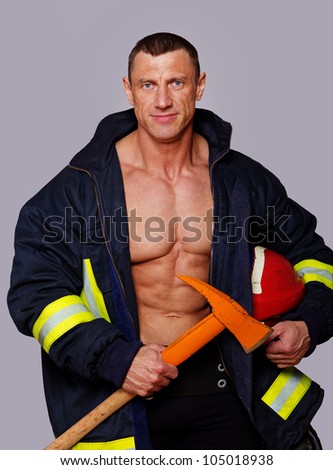 Portrait of fireman posing in studio
