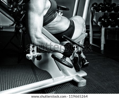 Image of muscle girl with dumbbells in gym
