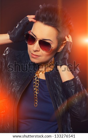 Hot stylish woman in leather clothes