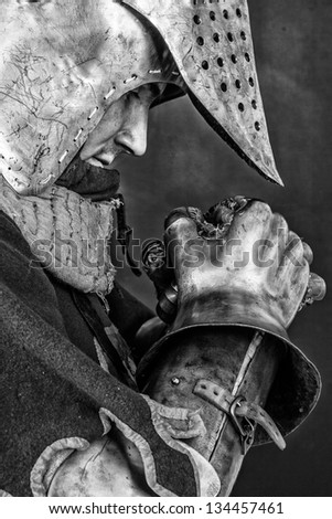 Sensitive black and white image of warrior who is praying