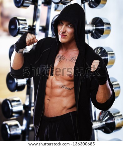 Image of muscle fighter posing in studio