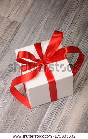 Cube white box with red ribbons