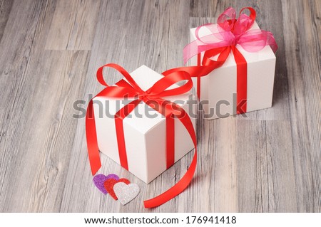 Romantic present boxes on a wooden surface