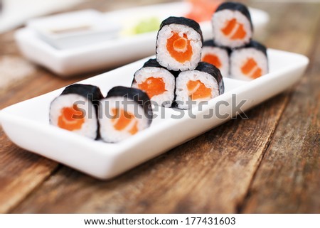 A set of salmon sushi on a plate