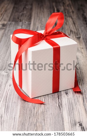White box with a red ribbon for christmas