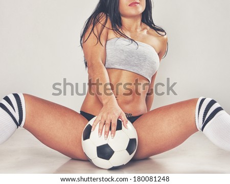 Image of sexy girl posing with ball