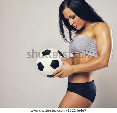 Image of muscle woman with ball