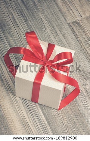 Cube white box with red ribbons