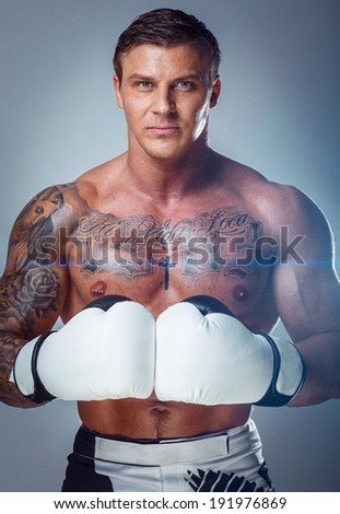 An isolate shot of a man wearing white gloves