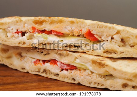 sandwich close up on a brown wooden Board