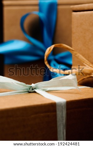 brown gift boxes with colored tape
