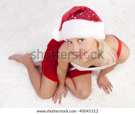 Portrait of attractive Santa sitting on fell