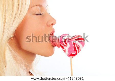 stock photo Attractive girl licking beautiful christmas lollipop