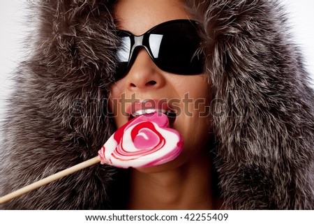 stock photo Portrait of sexy girl sucking Christmas candy
