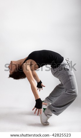 Picture of young woman dancing break dance