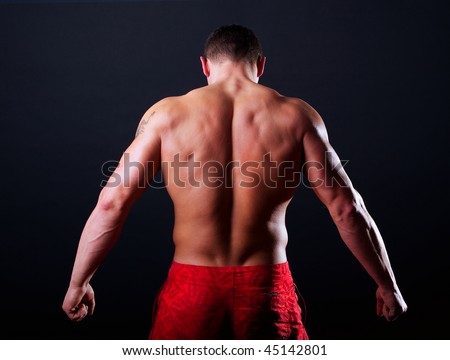 The bodybuilder back isolated on black background