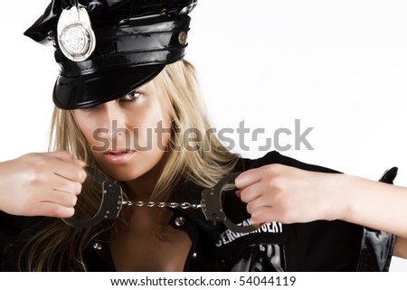 Sexy woman in uniform holding handcuffs