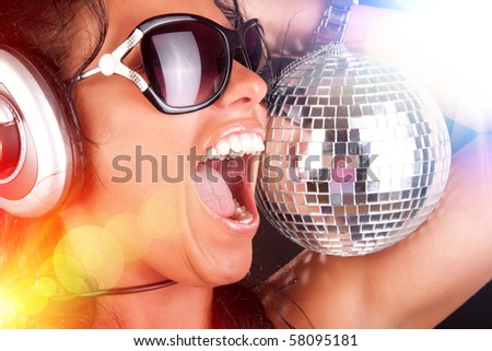 stock photo : Cute girl with headphones in nightclub