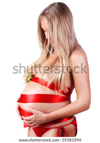 stock photo Sexy pregnant woman touching her stomach