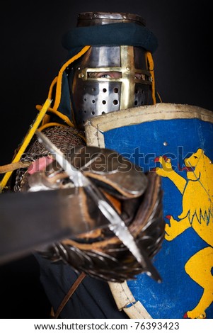 Image of knight with sword and shield