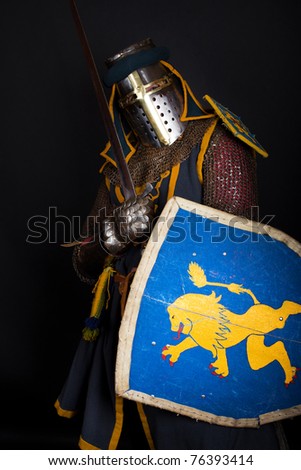 Crusader is holding a sword and shield