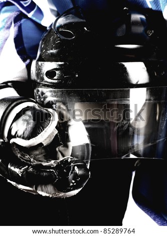 Picture of hockey helmet in hockey player hands