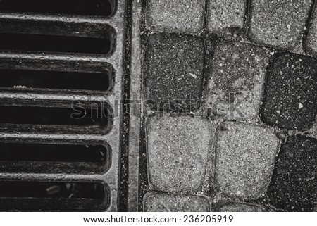 Storm drain closeup in black and white