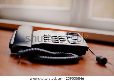 An old office phone on the table