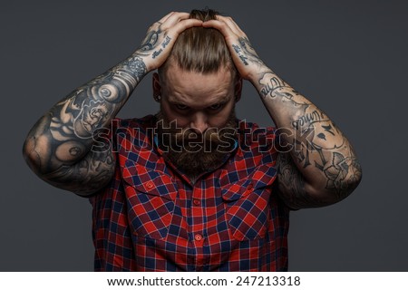 Picture of brutal tattooed male with beard