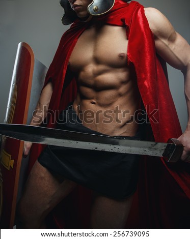 Roman warrior with sword and shield isolated on grey.