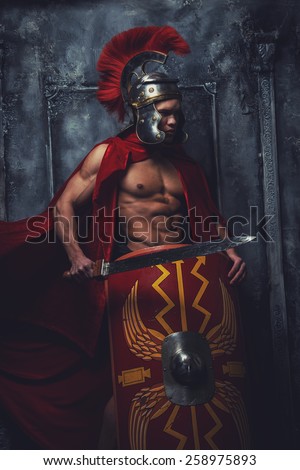 Roman warrior with muscular body holding sword and shield