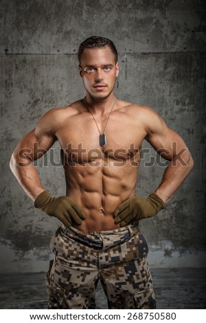 Men with perfect naked torso dressed in army pants