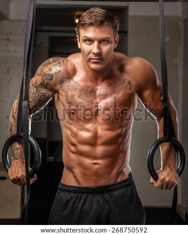 Bodybuilder posing in a gym