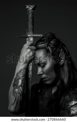 Elf woman with sword. Black and white photo