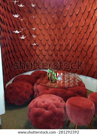 Image made by smartphone. Red restaurant decoration with raspberry